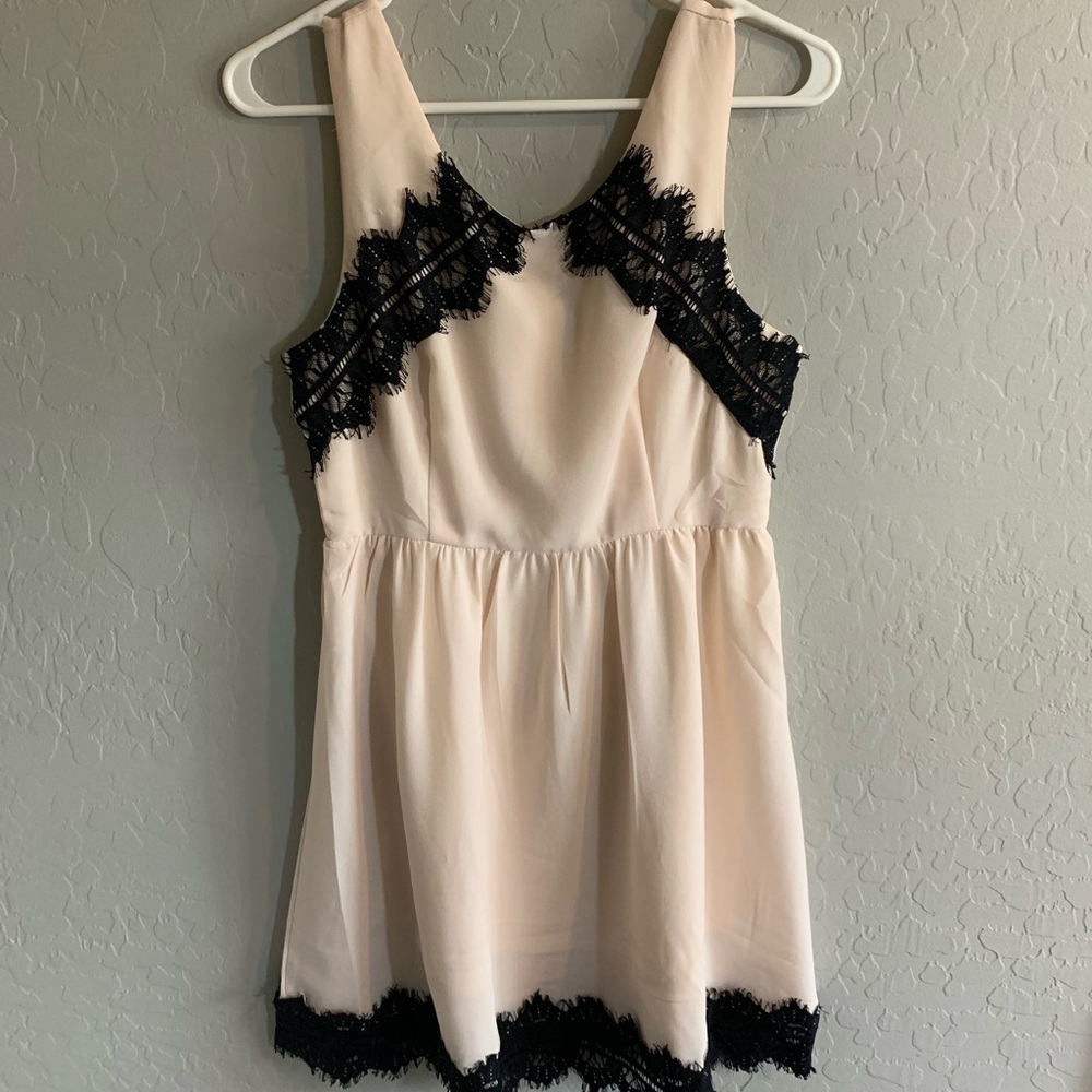 NSR cream and black lace dress